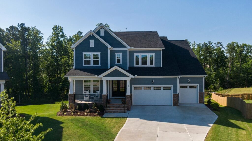 house with brick exterior and black roof