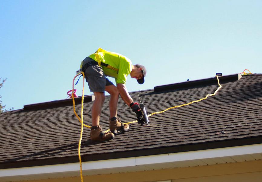 A man working on a roof