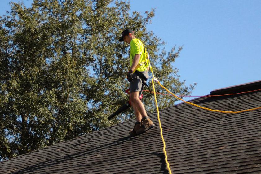 A contractor on a roof