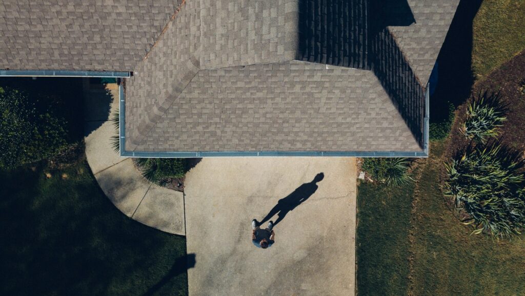 Aerial view of a man outside a house