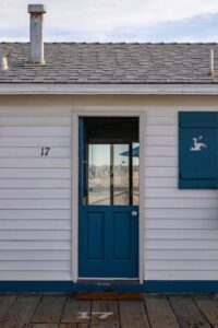 An image of a home with a blue door  