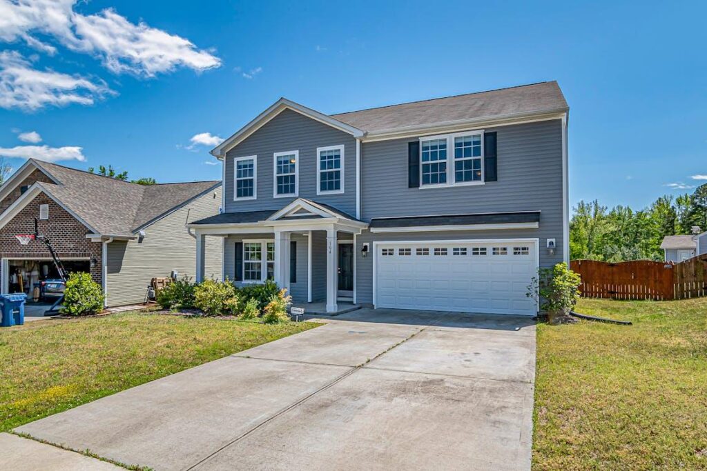 An image of a house with a driveway