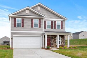 An image of a home with a driveway and garage  
