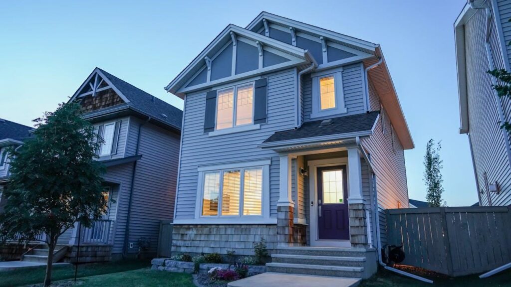 An image of a house with large windows