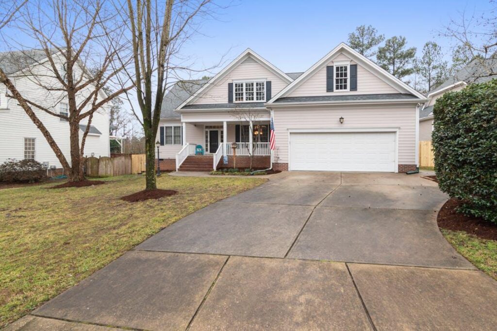 An image of a home with a long driveway