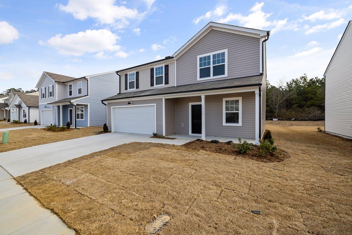 An image of a row of suburban houses under the blue sky
