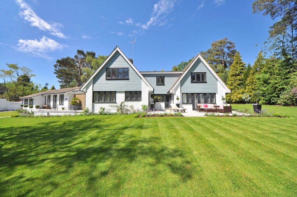 An image of a home with green grass