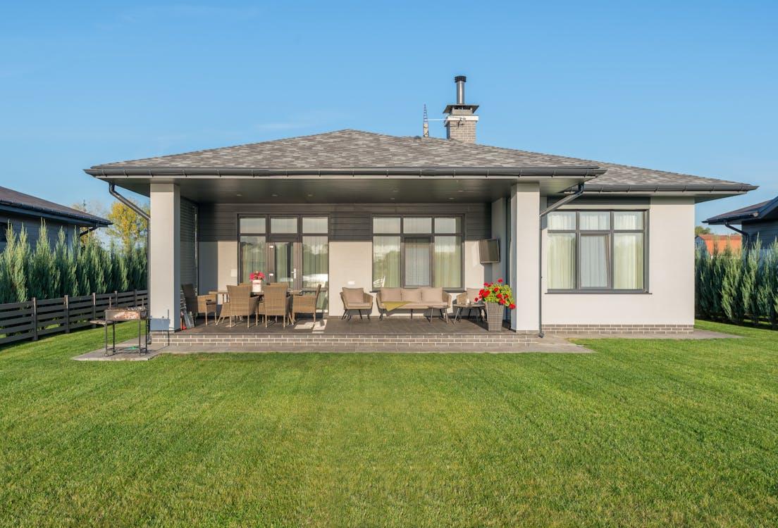 An image of a backyard with green grass   