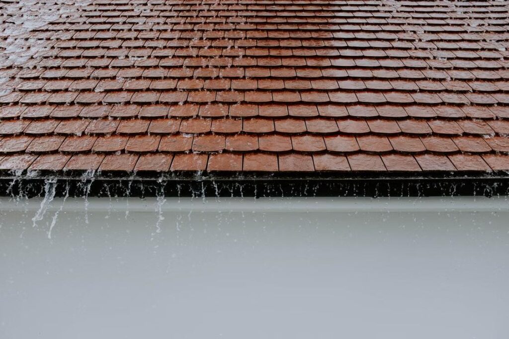 A residential roof during rainfall