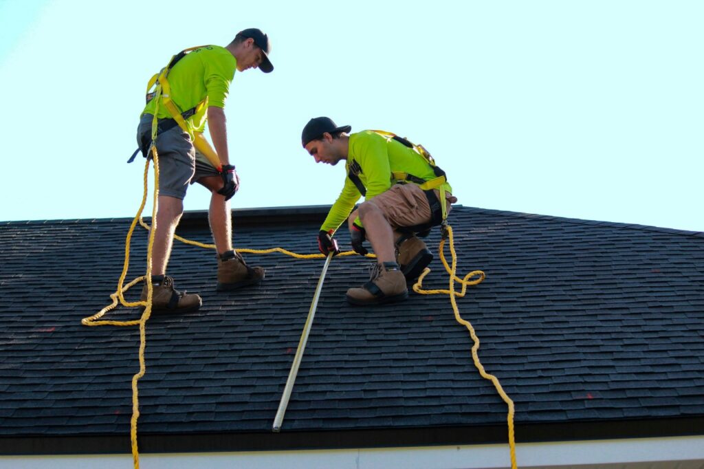 This photo shows some workers on a roof.