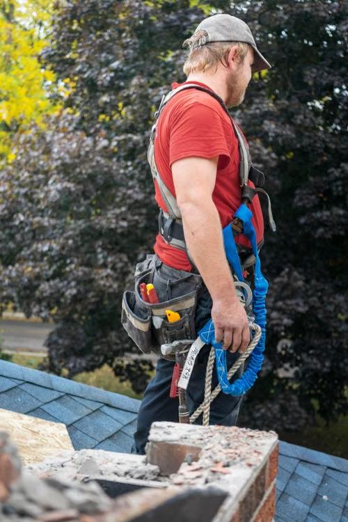 roofer inspecting residential roof