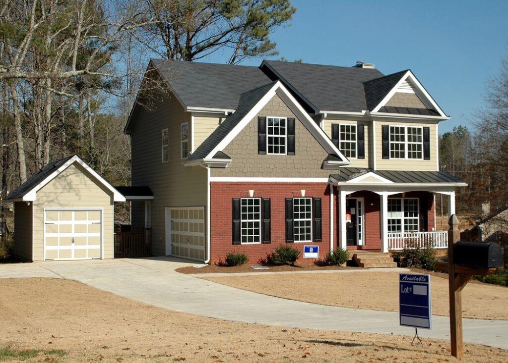An image of a grey and red house