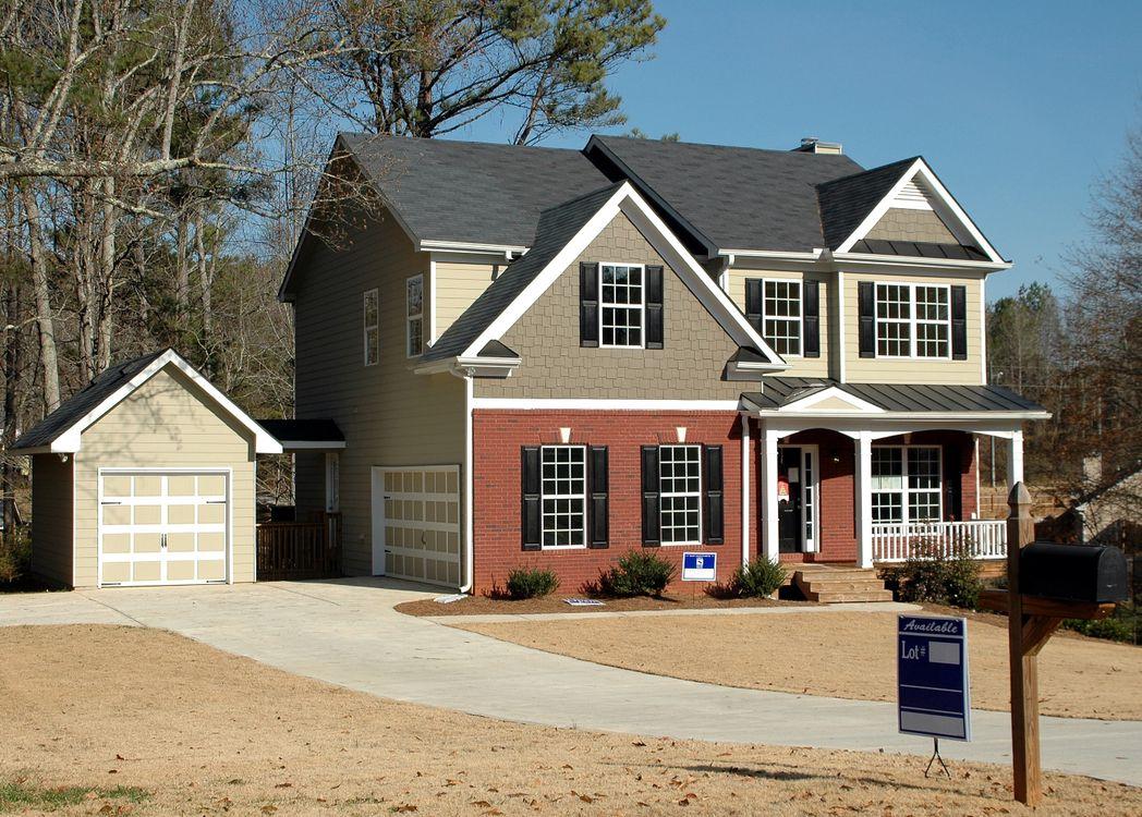 An image of a grey and red house